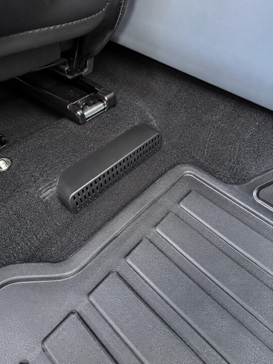 BYD Atto 3 under-seat air vent protective cover installed