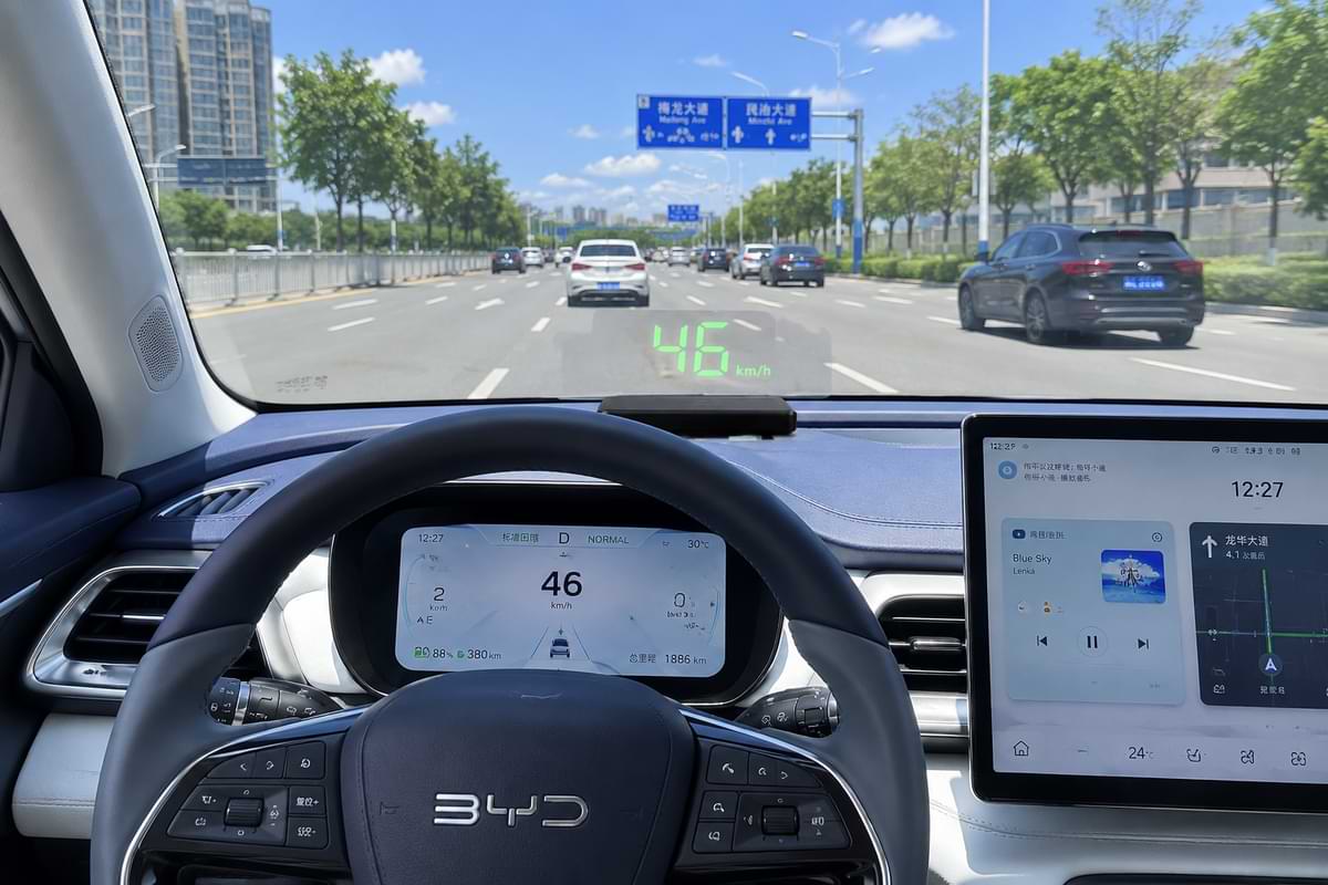 BYD daytime interior with GPS HUD speed display and white blue dashboard lighting