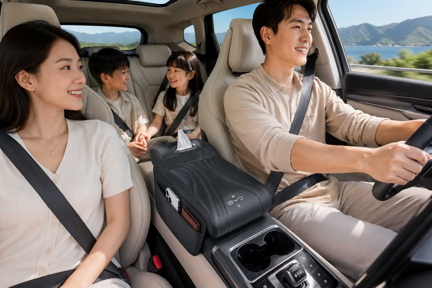 Family enjoying a road trip in a BYD vehicle with a premium armrest box heightening pad featuring storage pocket and tissue holder.