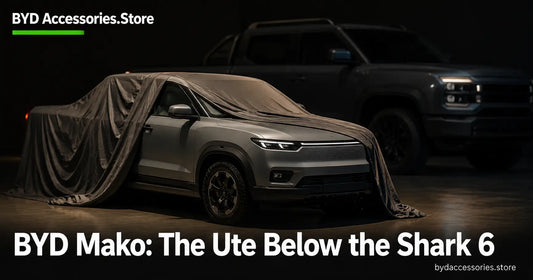 Compact unibody ute under a reveal cover with a larger dual cab silhouette behind, representing the BYD Mako below the Shark 6