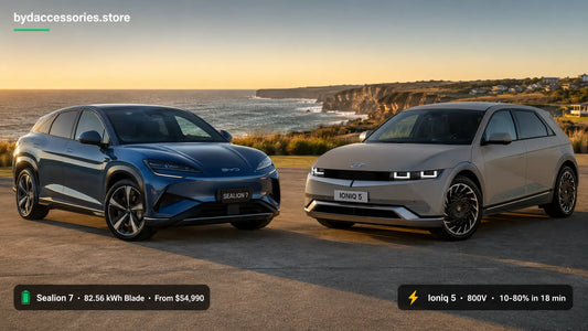 BYD Sealion 7 and Hyundai Ioniq 5 electric SUVs parked side by side on an Australian coastal forecourt at golden hour for comparison