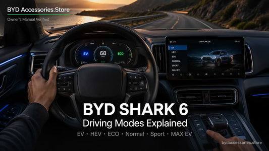 BYD Shark 6 interior showing EV and ECO driving modes on the digital dashboard while driving on a coastal highway