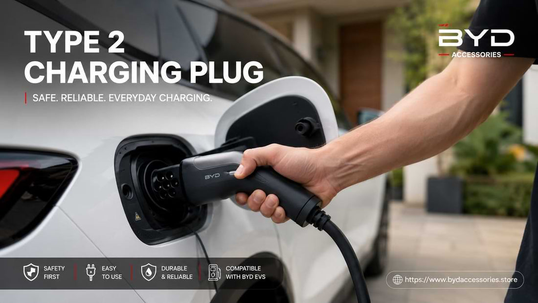 Close-up of a Type 2 charging plug connected to a white BYD electric vehicle in a residential driveway during daylight.