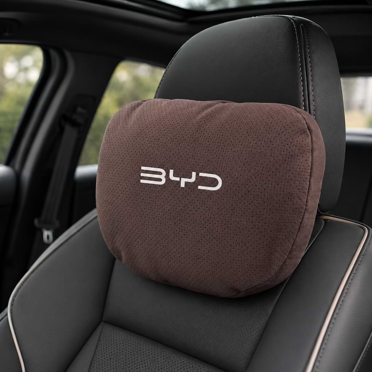 Car headrest pillow with BYD logo on a car seat