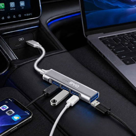 byd car USB hub connected to a laptop and smartphone inside a car.