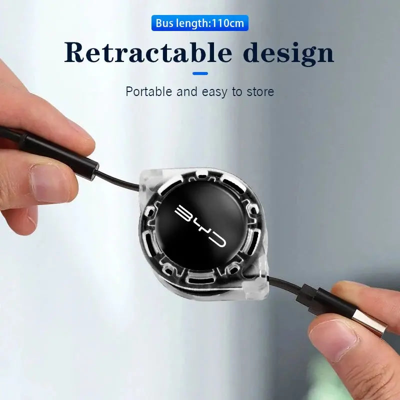 Retractable design product with hands holding it against  byd car
