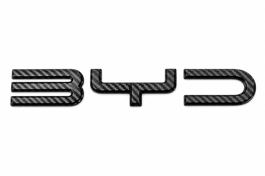 Carbon fiber front BYD emblem badge cover for BYD Dolphin EA1 (2024–2025), OEM-fit exterior logo replacement.