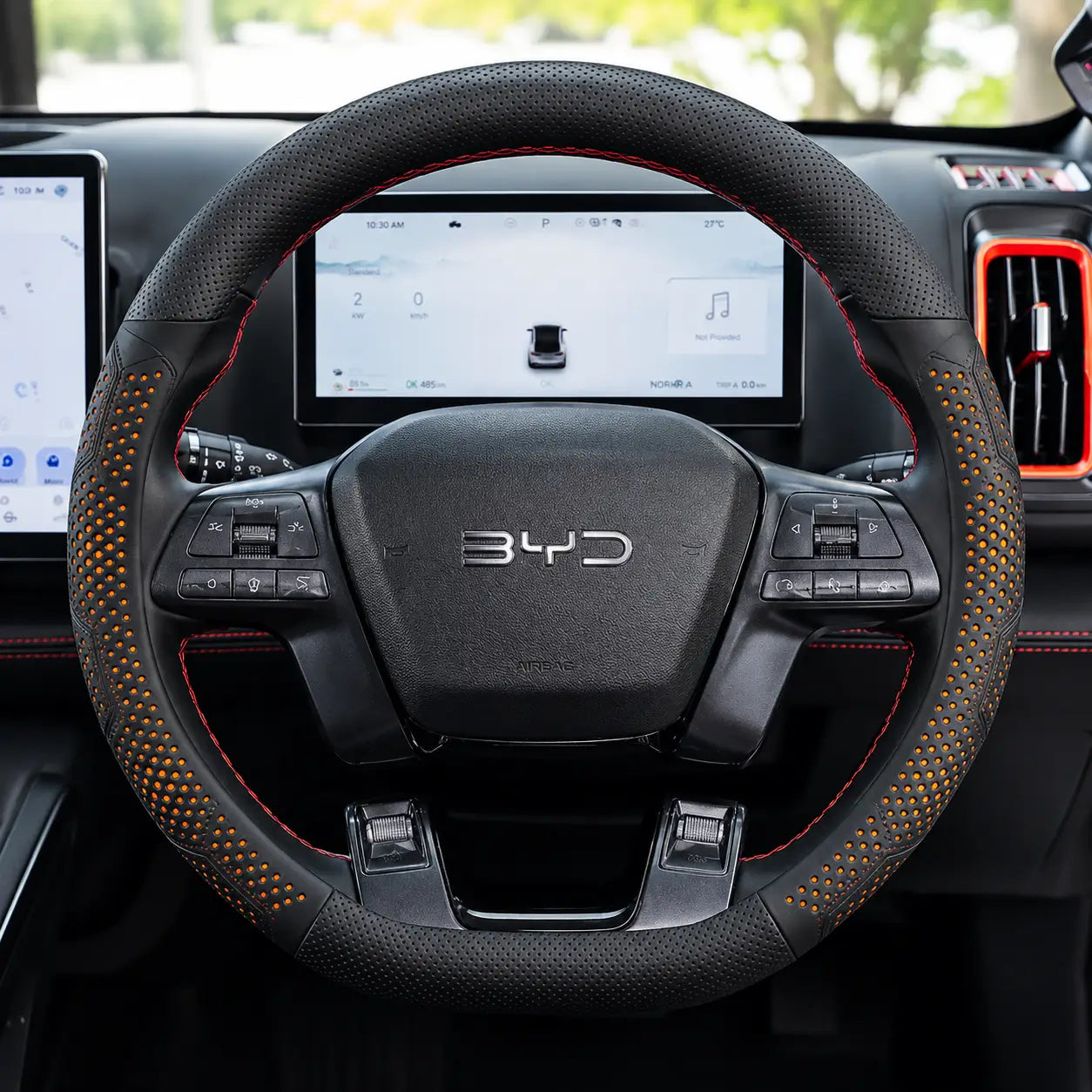 Leather steering wheel cover installed on BYD Shark 6 (2024–2025) with anti-slip breathable faux leather and black orange stitching.