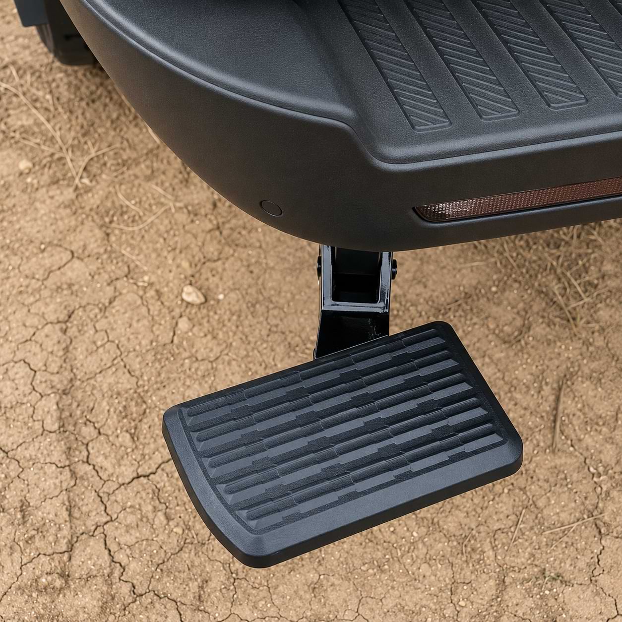 Close-up of a retractable rear tailgate step installed on a 2025–2026 BYD Shark 6 pickup truck with an anti-slip stepping surface.