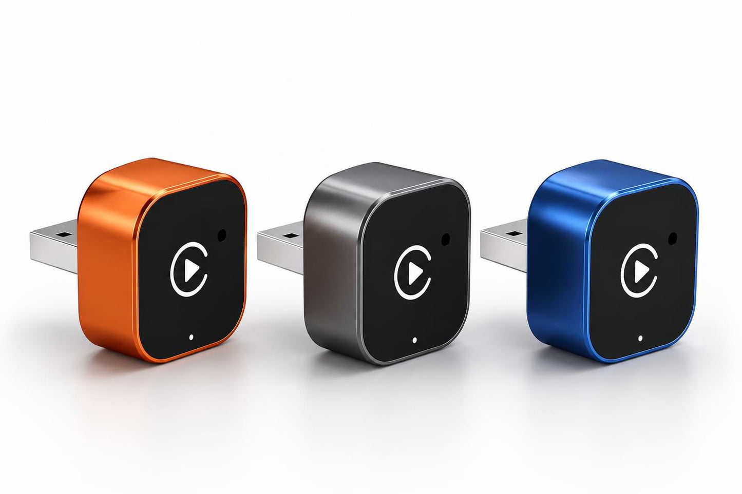Orange, gray, and blue BYD wireless CarPlay adapters displayed together on a white background with compact USB plug-and-play design.