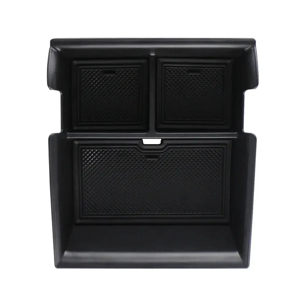 byd atto 3 Black car storage compartment with divided sections on a white background